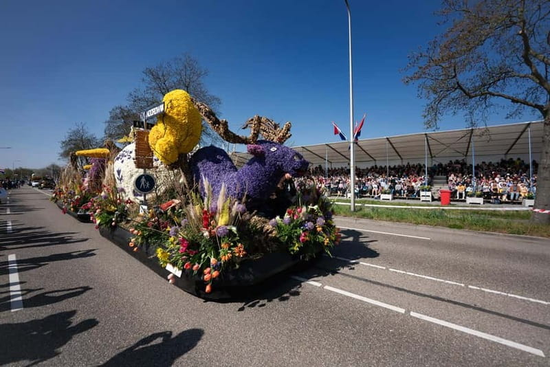 Amsterdam: Day Trip to Flower Parade & Keukenhof on April 18 - Grandstand seating during the 79th parade