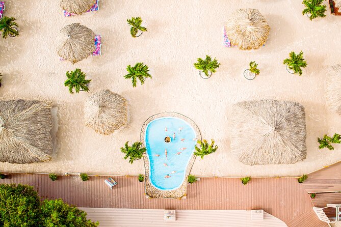 Aruba De Palm Island All-Inclusive Day Trip with Transport - Flamingos and paid upgrades