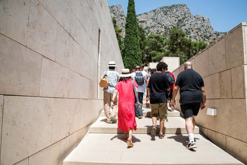 Athens: Delphi and Arachova Day Trip with Guide - Entering Delphi: temple, theater, stadium, and treasuries