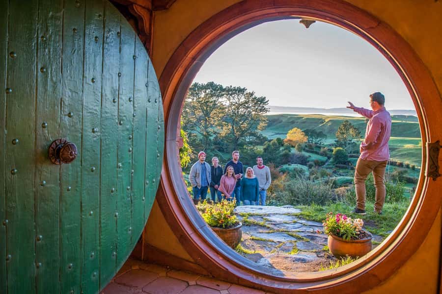 Auckland: Hobbiton Movie Set Day Trip with Festive Lunch - Walking through Hobbiton’s round doors