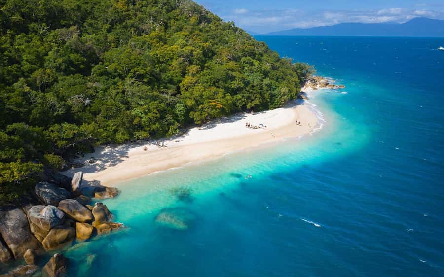 From Cairns: Fitzroy Island Day Trip by Ferry - Welcome Bay gives you an easy first stop
