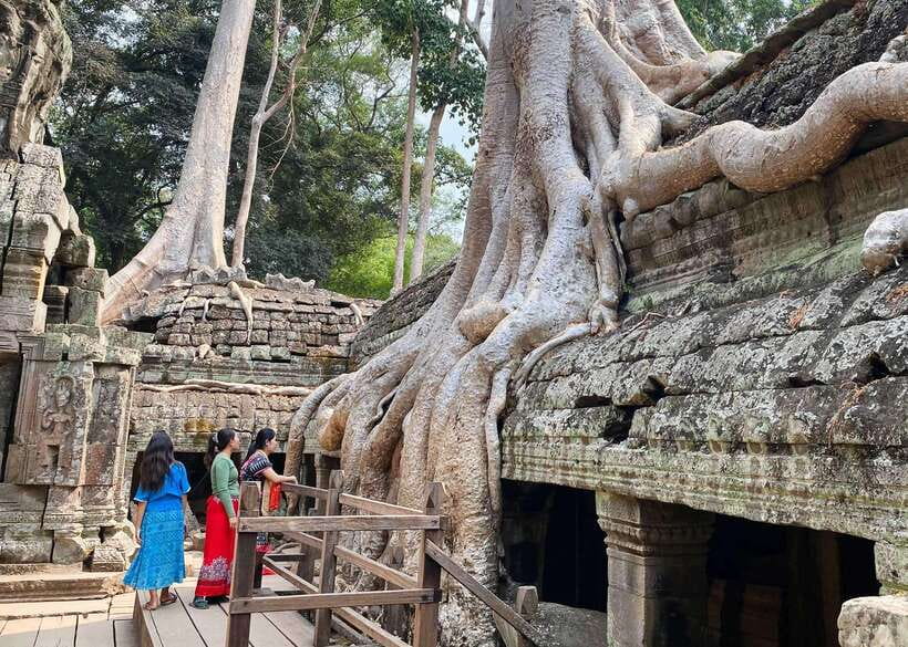 From Phnom Penh: Angkor Wat, Bayon, and Ta Prohm Day Trip - Bayon’s smiling stone faces