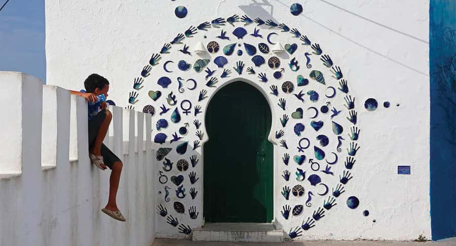 From Tangier: Asilah Day Trip with Cap Spartel & Camel Ride - Leaving Tangier and stopping at Rmilat Park