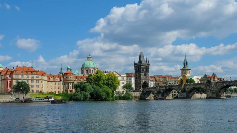 From Vienna: Full-Day Trip to Prague - First views of Prague: the National Theatre and riverside homes