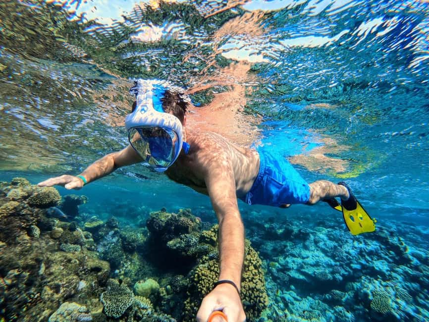 Hurghada: Orange Bay Day Trip with Water Sports and Lunch - Buffet lunch, fruit, and drinks back on board