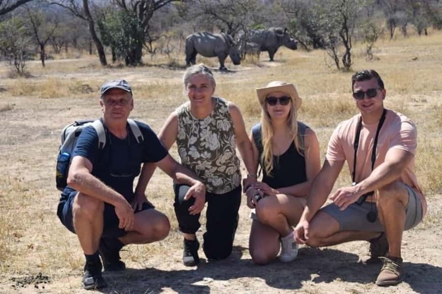 Matobo Hills Day Trip with Rhino Tracking - Walking quietly toward white rhinos
