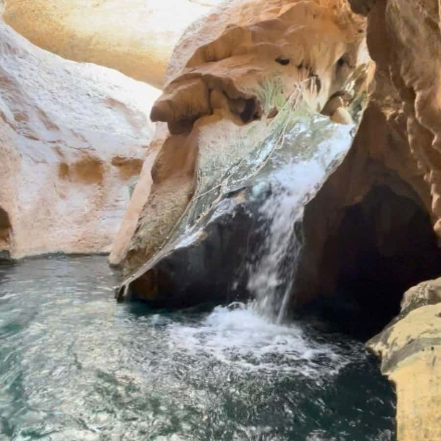 Muscat: Wadi Shab, Romantic Cave and Sinkhole Full-day Trip - Swimming through the Romantic Cave