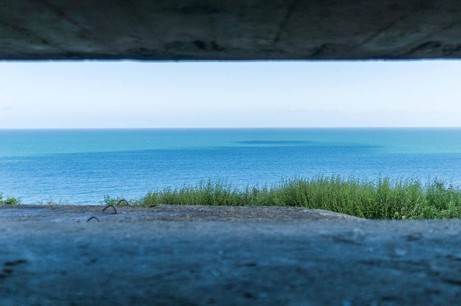 Normandy D-Day Small-Group Day Trip with Omaha Beach, Cemetery & Cider Tasting - Pointe du Hoc explains an extraordinary climb