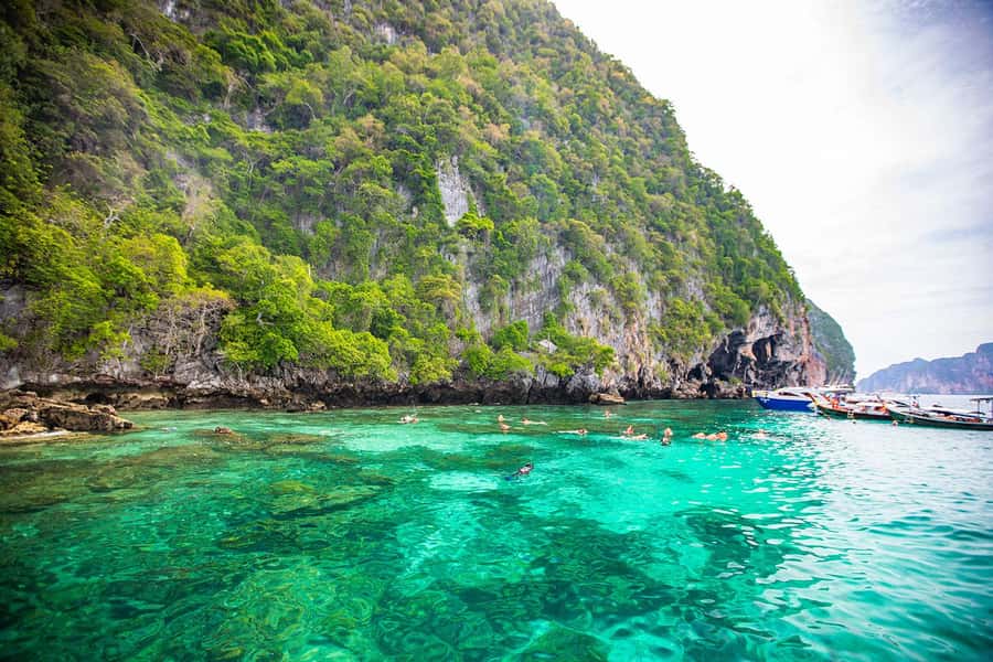 Phuket: Maya Bay, Phi Phi, Green, and Khai Islands Day Trip - Green Island and the first snorkeling stop