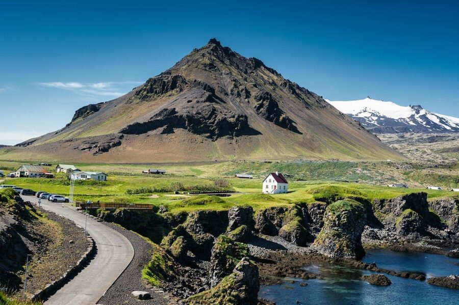 Reykjavik: Snæfellsnes Day Trip with Vatnshellir Lava Cave - Waterfalls, church views, and quieter roadside stops