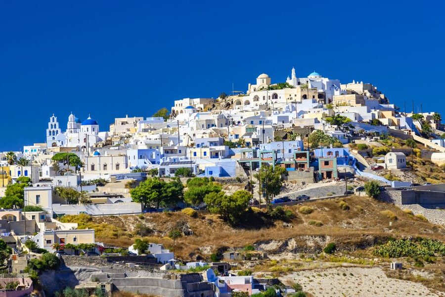 Santorini: Island Highlights Guided Day Trip with Oia Sunset - Pyrgos shows Santorini beyond the postcard streets