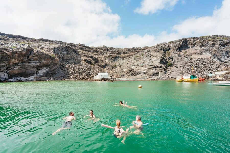 Santorini: Luxury Catamaran Day Trip with Meal and Open Bar - Greek food, local drinks, and the open bar
