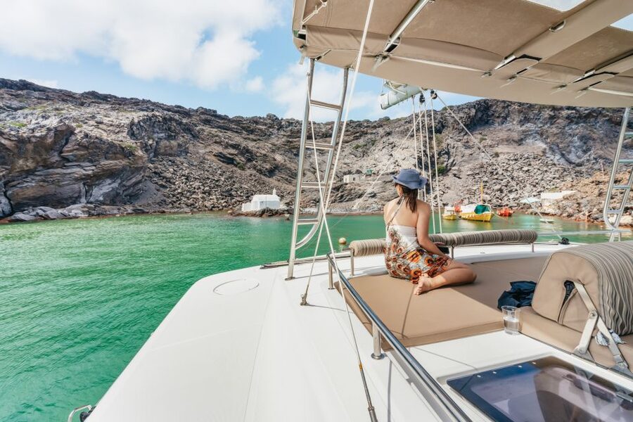 Santorini: Luxury Catamaran Day Trip with Meal and Open Bar - Pickup, port transfer, and timing