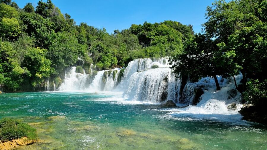 Split: Krka National Park Day Trip with Boat Ride & Swimming - Skradin’s one-hour beach stop