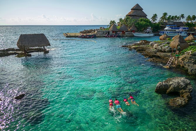 Xcaret Park Day Trip, transportation and Cultural Night Show - Swimming through the underground rivers